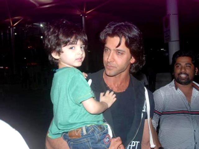 Hrithik holds his younger son Hridhaan.