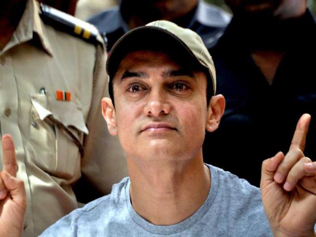 Aamir Khan looks visibly excited.