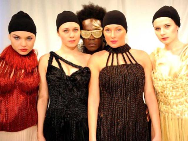 Models present outfits and fake glasses made with artificial hair by German fashion designer Luisa Verfuerth in Dortmund, western Germany. AFP/Patrik Stollarz