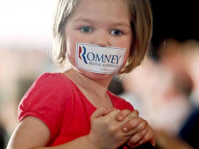 Maggie Teel, 5, wears a Romney sticker on her mouth as US Republican presidential candidate Mitt Romney holds a town hall meeting at Gateway Convention Center in Collinsville, Illinois. Reuters Photo/Sarah Conard