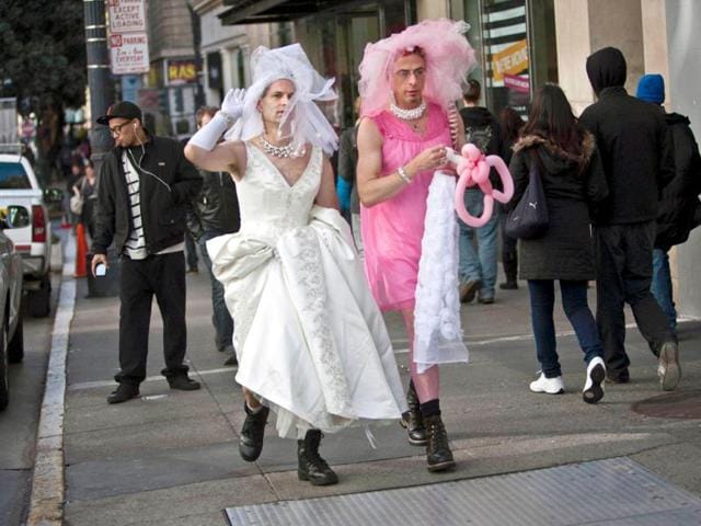 Participants arrive to take part in the March of Brides parade through downtown San Francisco. People don wedding clothes and stroll through the center of San Francisco during the annual event. Reuters/Jana Asenbrennerova