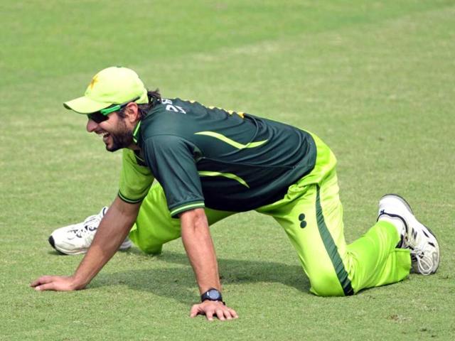 Pakistan's cricketer Shahid Afridi stretches during a team training session at The Sher-e-Bangla National Cricket Stadium in Dhaka. AFP Photo/Munir uz Zaman.