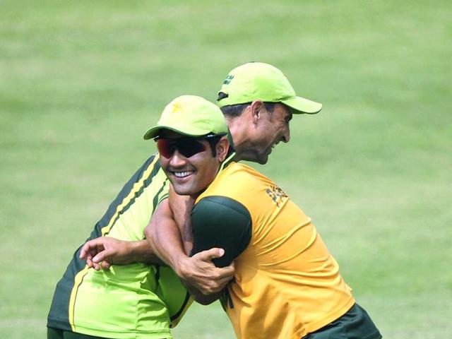 Pakistani cricketer Younis Khan (R) shares a light moment with his teammate Asad Shafiq (L) during a team training session at The Sher-e-Bangla National Cricket Stadium in Dhaka. AFP Photo/Munir uz Zaman.