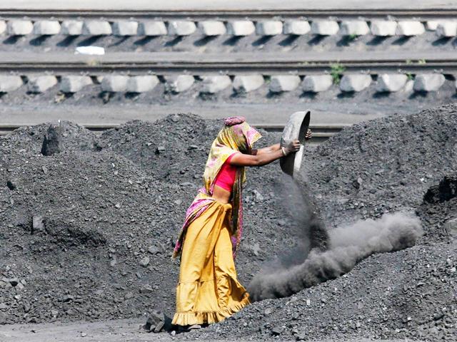 File-photo-A-labourer-works-inside-a-coal-yard-on-the-outskirts-of-Ahmedabad-Reuters File-photo-A-labourer-works-inside-a-coal-yard-on-the-outskirts-of-Ahmedabad-Reuters