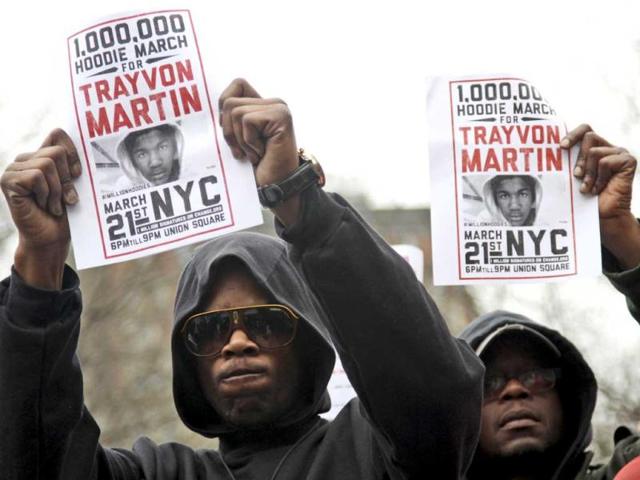 Tyrone Boykins, left, of the Brooklyn borough of New York, takes part in 'A Million Hoodies March' in Union Square in New York. AP Photo/Mary Altaffer