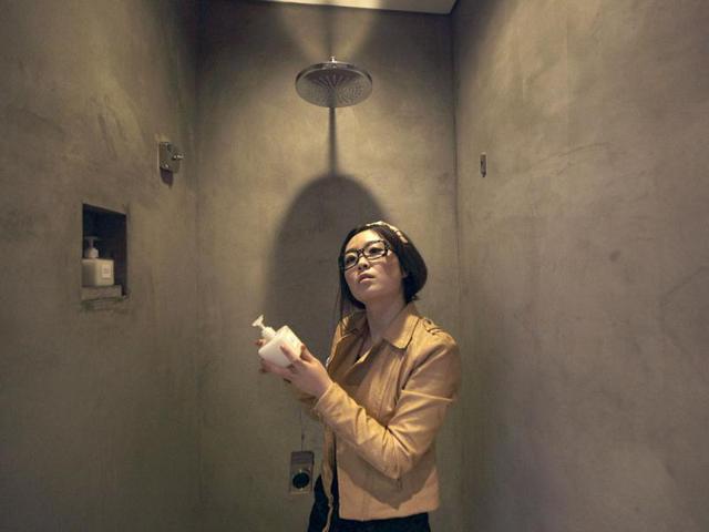 Zhuang checks a bottle of body wash in the bathroom of a boutique hotel in central Beijing. Zhuang was selected as one of three final winners out of 7,800 candidates and started working for Qunar as a Professional Hotel Test Sleeper. At present, she has slept at more than 200 hotels. "My job is to role-play travelers of different types, different ages and genders at different scenarios, and see how each hotel fits their particular needs." Zhuang said. (Reuters)