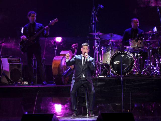 Canadian singer Michael Buble performs during the "Crazy Love" tour at Luna Park stadium in Buenos Aires, Argentina. AFP Photo / Juan Mabromata