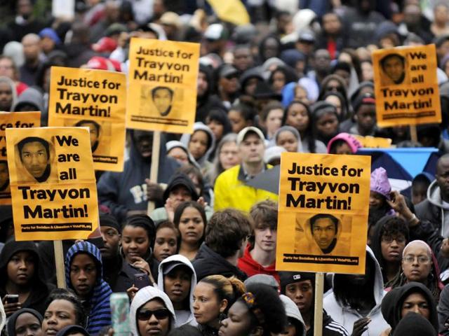 People gather at a "Stand Up for Trayvon Martin" rally in Washington. Rallies are being held in cities across the country this weekend to protest the failure of police to arrest a Florida neighborhood watch volunteer for shooting to death Martin, an unarmed black teenager. Protesters, some dressed in "hoodie" hooded sweatshirts like the kind 17-year-old Martin wore at the time of his death, gathered for events in Columbia, South Carolina, Washington, D.C. and Chicago Saturday. Reuters/Jonathan Ernst