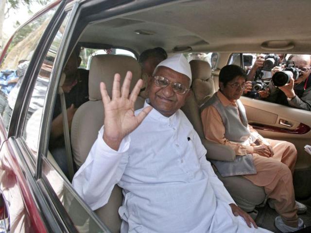 Veteran Indian social activist Anna Hazare waves to his supporters after his visit at the Mahatma Gandhi memorial at Rajghat, ahead of his day-long hunger strike against corruption in New Delhi. Multi-billion dollar corruption scandals in India have fed middle-class frustration with the ruling classes, and a relentless campaign by Hazare last year forced the government to bow to his demands and agree to draft anti-corruption legislation. REUTERS/Parivartan Sharma