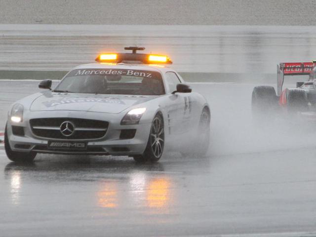 McLaren Formula One driver Lewis Hamilton of Britain follows behind the safety car during the Malaysian Formula One Grand Prix at Sepang. AP Photo/Achmad Ibrahim