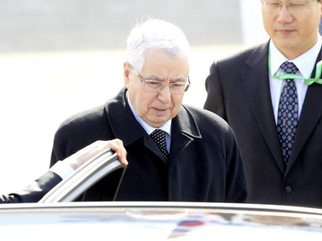 Algeria's head of the upper house of parliament, Abdelkader Bensalah walks to a vehicle upon arriving at Seoul Air Base in Seongnam, ahead of Monday's Nuclear Security Summit. Leaders from more than 50 countries, including US President Barack Obama, will gather in Seoul, for a March 26-27 nuclear security summit focusing on measures to protect nuclear materials and facilities and to prevent illicit trafficking. REUTERS/Eugene Hoshiko/Pool