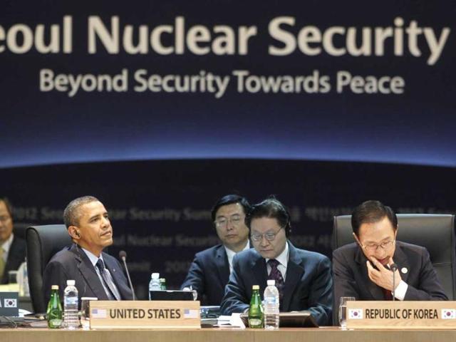 US President Barack Obama and South Korean President Lee Myung-bak attend the opening plenary session at the Nuclear Security Summit at the Coex Center, in Seoul, South Korea. Sitting in the center is South Korean President Lee Myung-bak. AP Photo/Pablo Martinez Monsivais