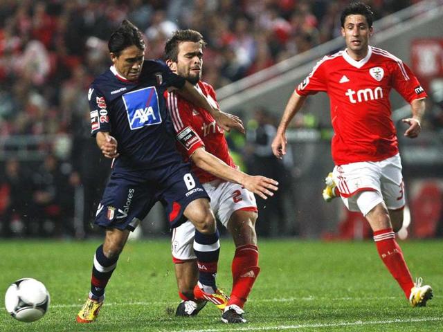 Benfica's defender Miguel Vitor (2nd R) vies with Braga's Brazilian midfielder Mossoro (L) during their Portuguese league football match at Luz Stadium in Lisbon. AFP/Patricia de Melo Moreira