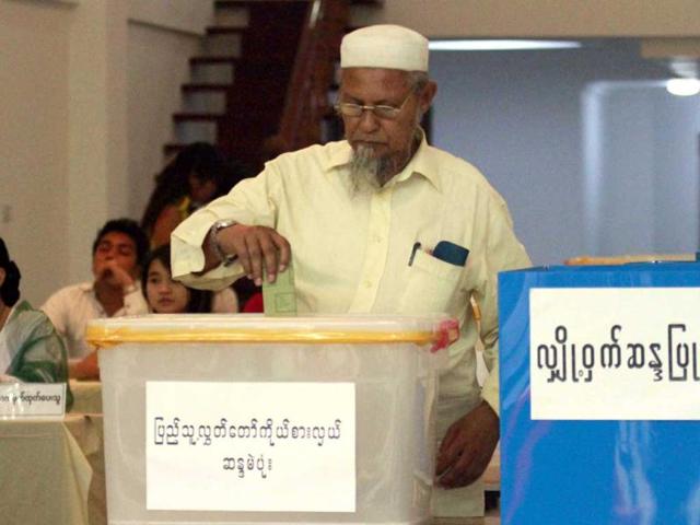A Myanmar man casts his vote at a polling station at Mingala Taungnyunt Township, Yangon, Myanmar. AP