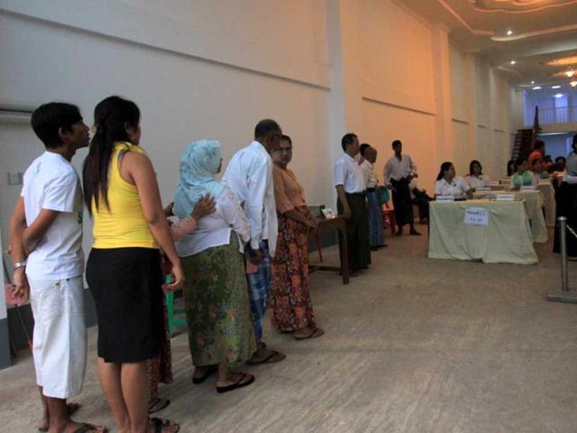 People queue to cast their vote at a polling station in Yangon. AFP/Ye Aung Thu