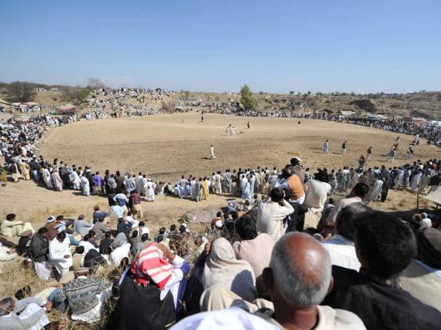 Spectators watch a dog fighting match in Tangdhe Sayedan, a village in the breadbasket province of Punjab, 110 kilometres east of Islamabad. AFP/Aamir Qureshi
