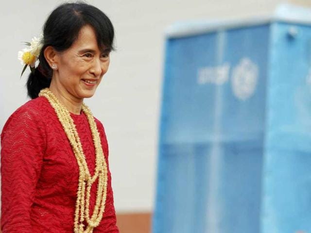 Aung San Suu Kyi smiles as she visits a polling station in Kawhmu township where she stands as a candidate in parliamentary by-elections. Reuters photo/Damir Sagolj