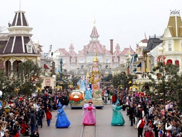 Disney characters parade during the 20th birthday celebrations of Disneyland park in Chessy, near Marne-la-Vallee, outside Paris. AFP/ Thomas Samson