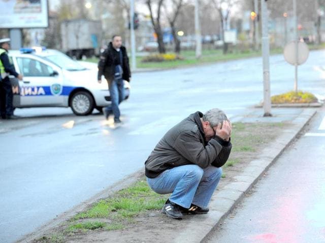 A man reacts in front of the nightclub Contrast in Novi Sad, Serbia. Serbian police say six people died in a nightclub fire in the city in the country's north. (AP Photo)