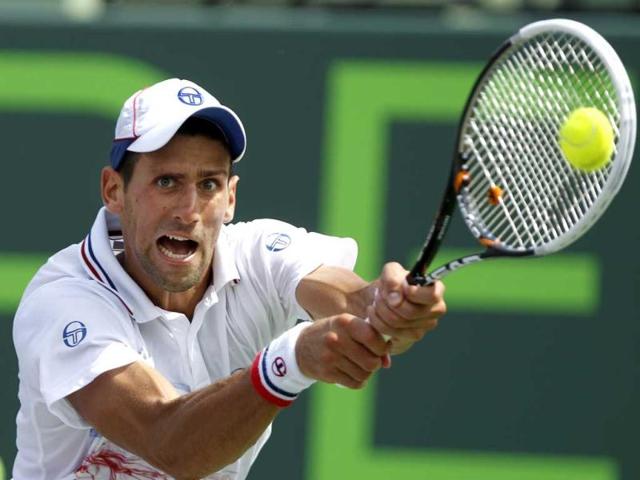Novak Djokovic hits a return to Andy Murray, during the men's singles final at the Sony Ericsson Open tennis tournament, in Key Biscayne. Djokovic won 6-1, 7-6 (4). (AP Photo)