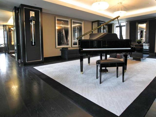 Reception room with baby grand piano and large desk in one of the five bedroom luxury penthouse apartments overlooking Hyde Park, London which is available for hire during the London 2012 Olympics for some 11,000 British pounds (US$17,600) a night - and includes a maid a butler and and Aston Martin car. AP Photo/Alastair Grant