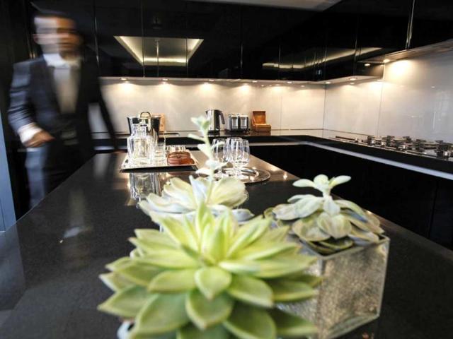 The kitchen area of the luxury apartments overlooking Hyde Park, London which is available for hire during the London 2012 Olympics for some 11,000 pounds - and includes a maid a butler and and Aston Martin car. AP Photo/Alastair Grant