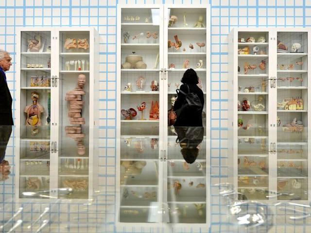 Visitors view Trinity-Pharmacology, Physiology, Pathology by British artist Damien Hirst at the Tate Modern gallery in London. Reuters/Toby Melville