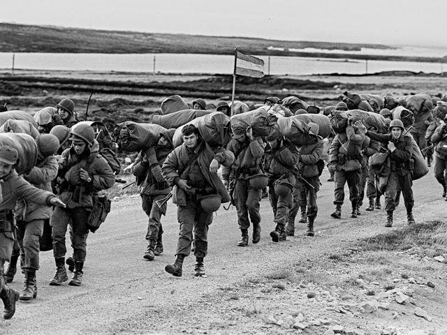(FILE) File picture dated 13 April 1982 shows Argentine soldiers in their way to occupy the captured Royal Marines base in Puerto Argentino/Port Stanley, a few days after the Argentine military dictatorship seized the islands Malvinas/Falklands, starting a war between the Argentina and the United Kingdom. Thirty years ago a remote South Atlantic island chain was thrust into the global glare as Britain and Argentina went to war over the Falklands, triggering a bitter conflict which rankles to this day. AFP/Daniel Garcia