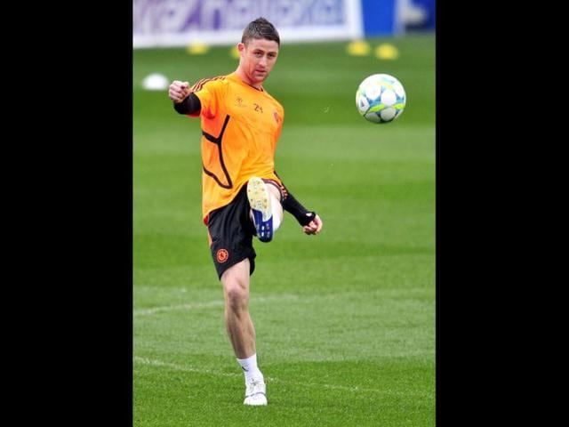 Chelsea's English defender Gary Cahill kicks the ball during a training session at Stamford Bridge in London ahead of their UEFA Champions League quarter-final second leg football match against Benfica. AFP/Glyn Kirk