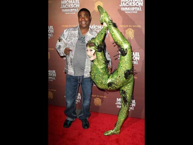 Actor-comedian Tracy Morgan poses with Cirque Du Soleil performer Baska at the "Michael Jackson: The Immortal World Tour," the Cirque Du Soleil show honoring the late entertainer at Madison Square Garden in New York. (AP Photo)