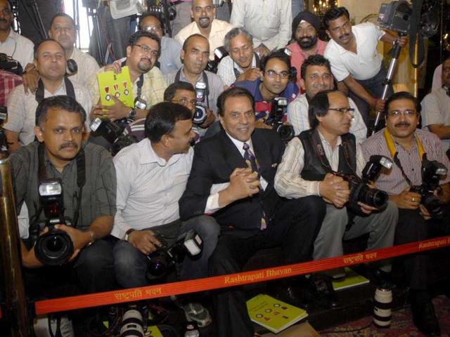 Actor Dharmendra rather comfortable sitting with the photographers during the presentation of Padma Awards.