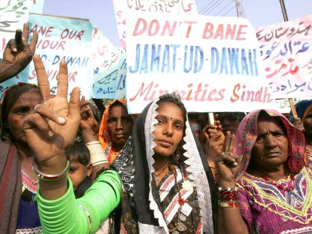 Pakistani non-Muslim minority supporters of Islamist charity organisation Jamaat-ud-Dawa protest in Hyderabad December 16, 2008. Reuters/Akram Shahid