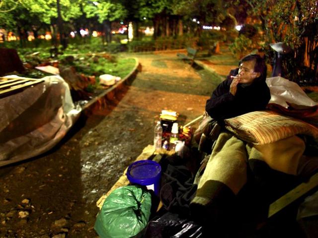 Irena, a 50 years old Polish homeless worker, smokes a cigarette on a bench at a park, where she lives, in central Athens. Irena's husband had died on Christmas day next to her in the same park. Greece's jobless rate hit a record high of 18.4 % in August, with the number of unemployment rising to 907,953, about 48% up from 2010. Estimates by NGO Klimaka and the Red Cross put the number of homeless people in Greece at around 20,000 of these. According to the European Federation of National Organizations working with the Homeless (FEANTSA), there has been a dramatic rise in homelessness in Greece; the vast majority of them are foreign immigrants. REUTERS/Yannis Behrakis
