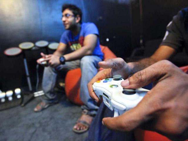 Employees of game company Dhruva Interactive play a game for which they designed the graphics, at their office in Bangalore. As gaming scales up, the advantages of outsourcing are becoming apparent to the firms on the US West Coast that dominate the sector. (Reuters)