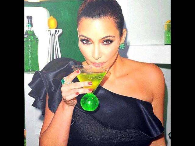 Holding something the colour of absinthe: “I need a drink! LOL”