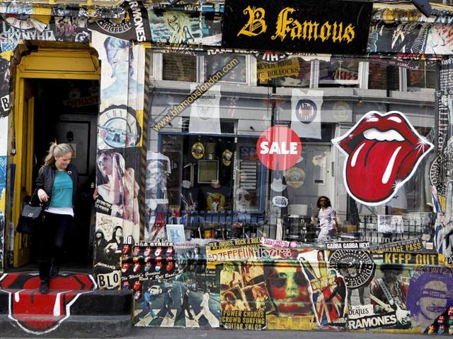 A woman leaves a shop on the Portobello Road, in Notting Hill in London. Reuters/Andrew Winning, Files