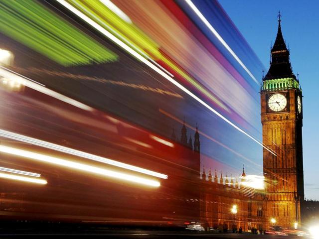 Light trails shine from a passing bus in front of Big Ben and the Houses of Parliament in London. Reuters/Luke MacGregor, Files