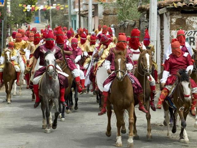 Actors perform the Way of the Cross in Tzintzuntzan community in Michoacan, Mexico. The actors are called "Espias" (spies), and ride around the community searching for Christ. (AFP Photo)