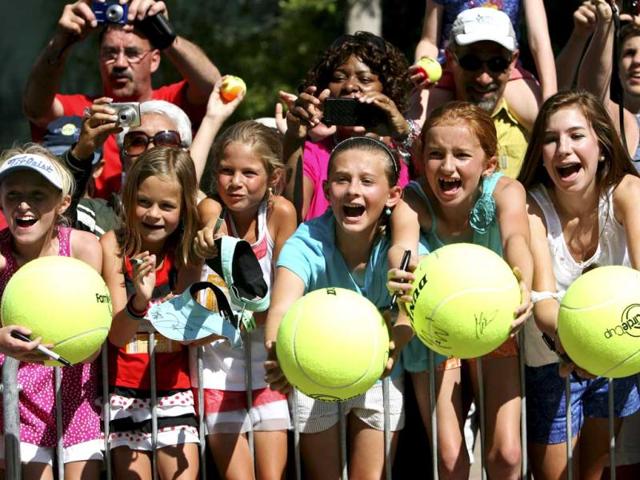 Fans scream for an autograph from Serena Williams after her match against Marina Erakovic, of New Zealand, at the Family Circle Cup tennis tournament in Charleston. (AP Photo)