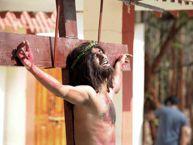 Catholics re-enact the crucifixtion of Jesus Christ during a 'passion play' tableau at The Mount Caramel Church in Hyderabad. Passion plays, a dramatic presentation depicting the suffering and death of Jesus Christ, are an integral part of Good Friday celebrations for Catholics. AFP/Noah Seelam