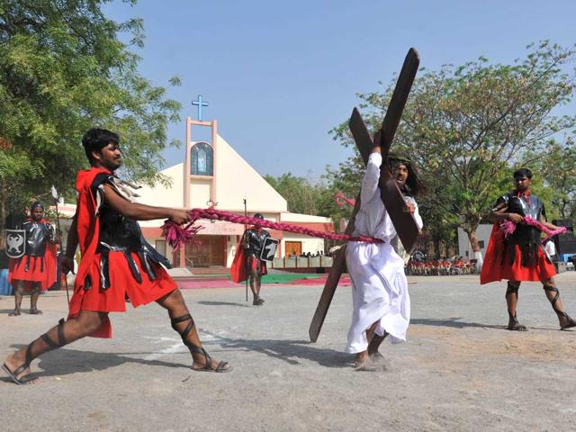 Catholics re-enact the crucifixtion of Jesus Christ during a 'passion play' tableau at The Mount Caramel Church in Hyderabad. Passion plays, a dramatic presentation depicting the suffering and death of Jesus Christ, are an integral part of Good Friday celebrations for Catholics. AFP/ Noah Seelam