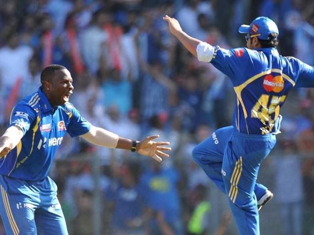 Mumbai-Indians-cricketers-Kieron-Pollard-L-and-Rohit-Sharma-celebrate-the-wicket-of-Pune-Warriors-India-batsman-Callum-Ferguson-during-the-IPL-Twenty20-cricket-match-at-The-Wankhede-Stadium-in-Mumbai-AFP-Indranil-Mukherjee