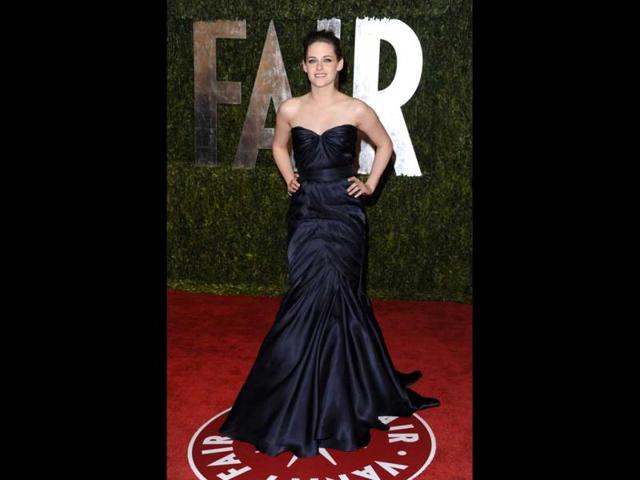 Kristen Stewart in a flowing royal blue gown at the Vanity Fair Oscar Party (AP)