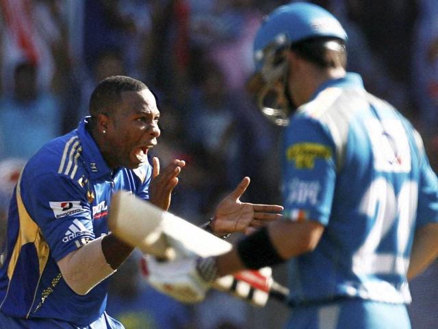 Mumbai Indians bowler K Pollard (L) celebrates the wicket of Ferguson of Pune Warriors during their IPL T20 match in Mumbai. PTI/Shashank Parade