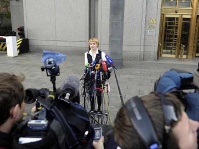 Alla, wife of Viktor Bout, speaks to the media outside Manhattan Federal court after his client was sentenced to 25 years in New York. Bout was convicted of conspiring to sell millions of dollars worth of weapons, including anti-aircraft missiles, to men he believed were terrorists intending to kill Americans. AFP PHOTO / STEPHEN CHERNIN