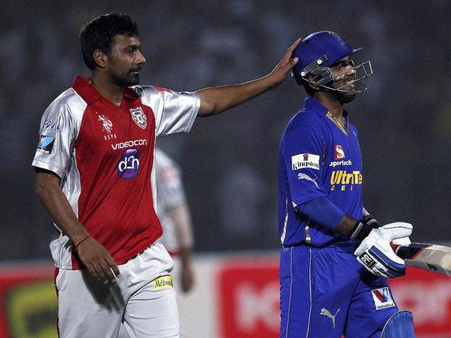 Kings XI Punjab's Praveen Kumar congratulates Rajasthan Royals Ajinkya Rahane after Rahane was bowled on 98 runs during their IPL-5 match in Jaipur. (PTI Photo/Aman Sharma)