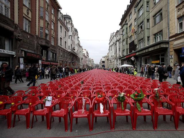 Red chairs are displayed along a main street in Sarajevo as the city marks the 20th anniversary of the start of the Bosnian war. AP Photo/Amel Emric