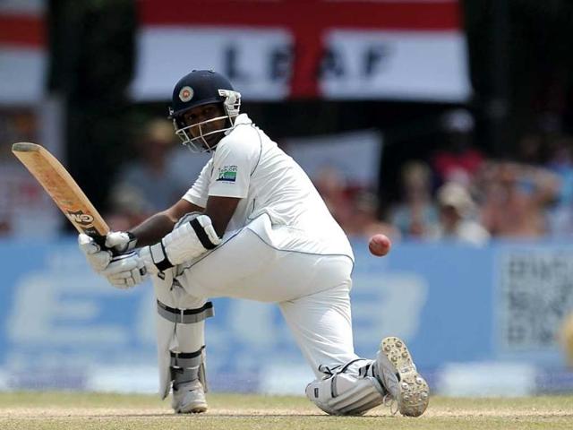 Sri Lankan cricketer Prasanna Jayawardene is bowled by England cricketer Graeme Swann during their final day of the second and final Test match at the P Sara Oval crickrt Stadium in Colombo. AFP Photo/ Lakruwan Wanniarachchi