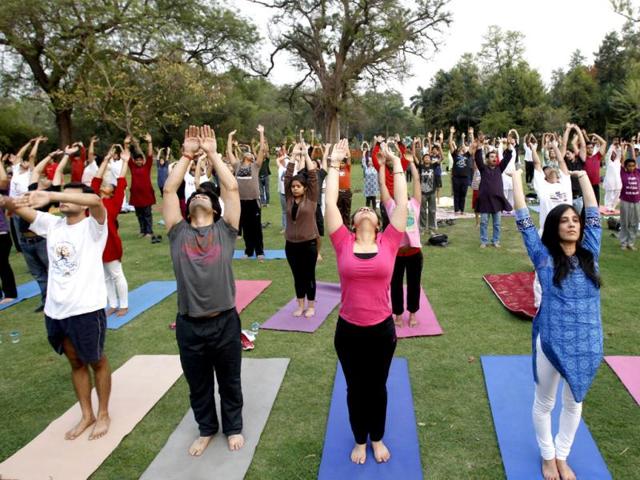 People participate in a Yogathon, a nation-wide initiative by the Art of Living to create awareness about yoga, to mark World Health Day in New Delhi. (AP Photo/Tsering Topgyal