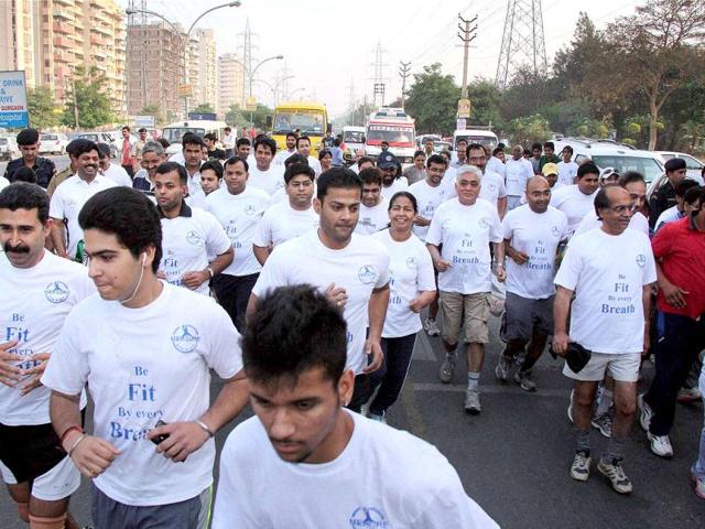 People take part in a run organised to mark the World Health Day in Gurgaon. PTI